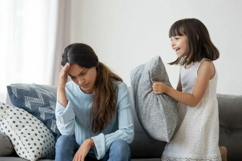 Crying woman with upset child causing emotional distress and frustration, building brain connections through challenging family interactions.